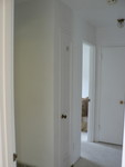 the hallway leads to two front bedrooms