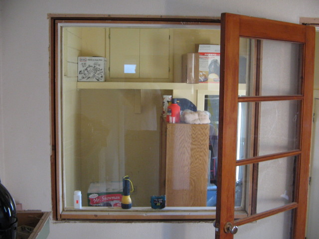 The window to the laundry room will be made smaller so the edging was removed to get ready for that. The door next to it will go away so it had the edging removed too.